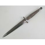 A Post WWII Fairburn Sykes 2nd pattern Commando dagger, blade marke indistictly 'The FS Fighting?'