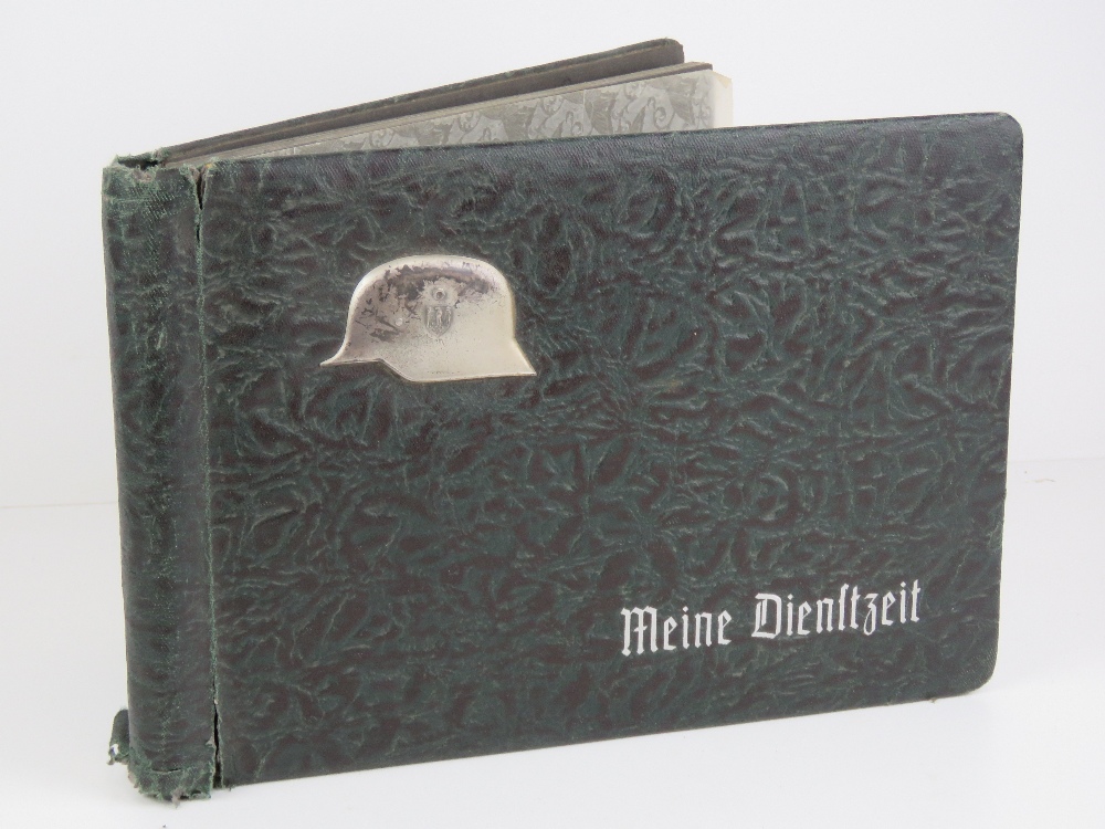 A WWII German photograph album including military groups and topography/sites.