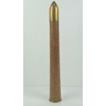 An inert WWII US 2pr wooden training shell with brass base and head, dated 1942.