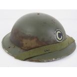 A WWII British 'Brodie' combat helmet dated 1941 made by Briggs Motor Bodies Dagenham,