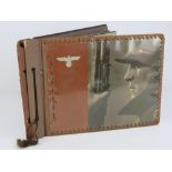 A WWII German Army Wehrmacht photo album including a set of 'candid' shaving photographs,