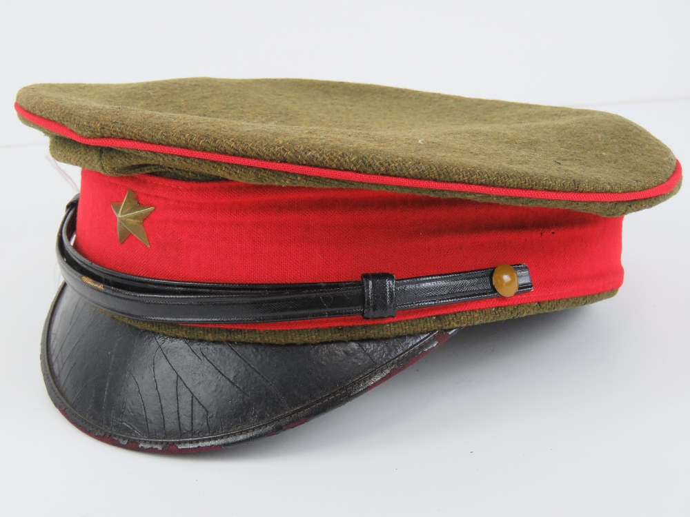 A WWII Japanese Army peaked cap, label within.