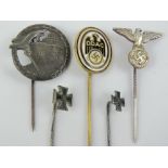 Five assorted WWII German stick pin badges including; Blockade Breaker, Iron Cross, DDAC and SS.