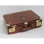 A fine leather covered dispatch box bearing insignia for the Ulster Defence Regiment and having