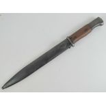A WWII German K98 bayonet dated 1941 with later sheath, 25cm blade, wooden grips.