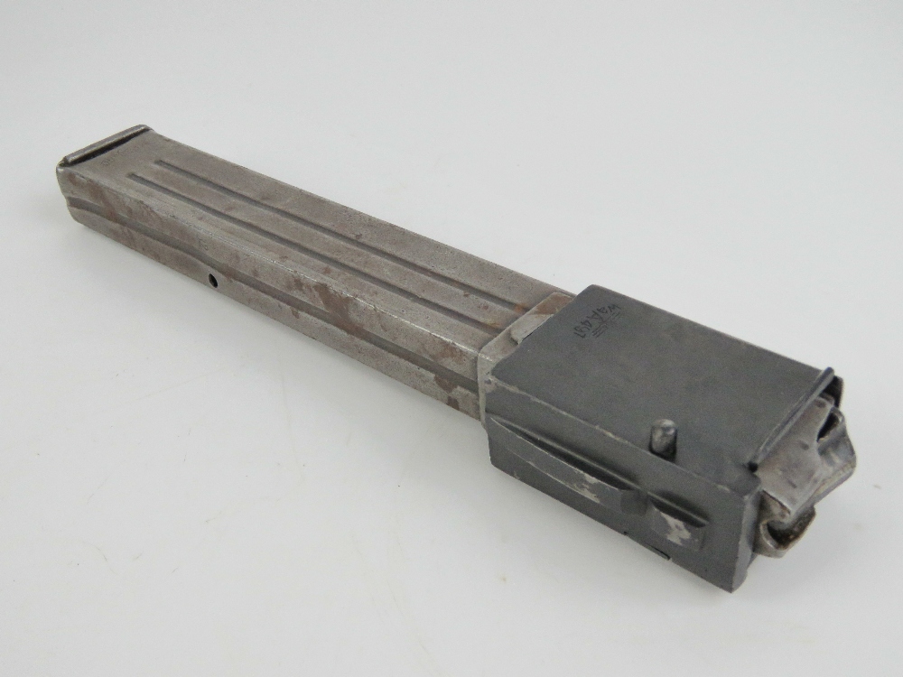 A WWII German MP38/40 magazine with adaptor for the Russian PPSH41.