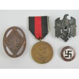 Four assorted WWII German badges including; party badge, Army,