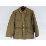 A WWII Japanese army tunic with ranking insignia upon, having packet within inside pocket.