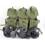 Three British gas masks; two Special Forces and one c1960s. Each with bag.
