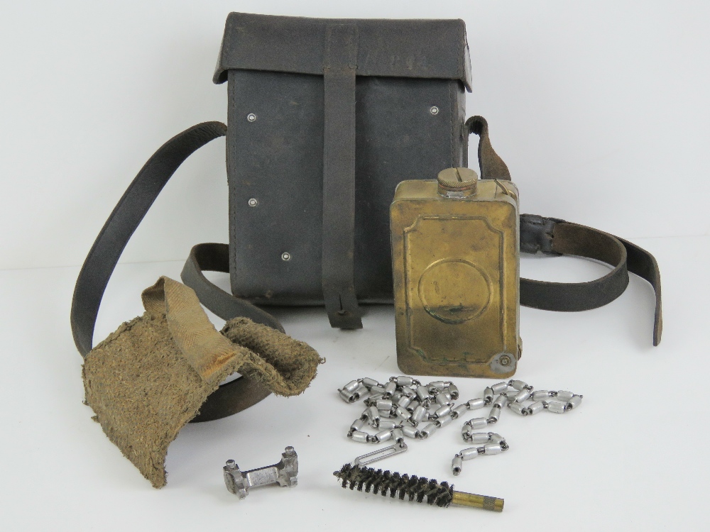 A WWII German gunners kit for the MG34 including barrel mitt and leather case.