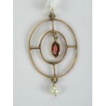 An Edwardian garnet and pearl pendant of circular form, no apparent hallmarks, 4cm in length, 1.5g.