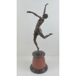A superb Art Deco dancing girl bronze signed Bzach to the base and raised on a conical rouge marble