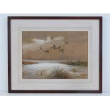 AR Roland Green (1896-1972) watercolour; Ducks in flight over an estuary, signed lower right,