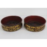 A delightful pair of late 19th century papier mache and gilded wine coasters, each 13.5cm dia.