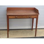 A 19th century mahogany wash stand, single frieze drawer, raised over tapering legs, 94cm wide.