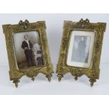 A pair of French ornate cast brass photograph frames with swag, bow,