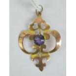 A 9ct gold art nouveau pendant of floral form, having central round cut amethyst, stamped 9ct, 3.