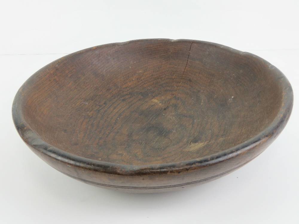 A 19th century Oak pole-lathe turned bowl, 13 1/2" (34.3 cm) diameter.