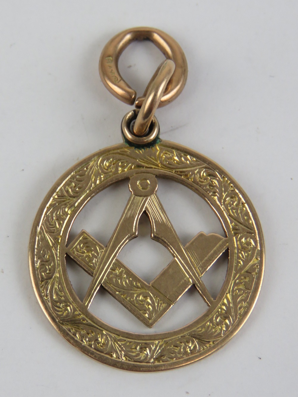 A 9ct rose gold Masonic charm or fob, 24mm dia not inc bale, hallmarked London, 5.5g.