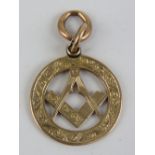 A 9ct rose gold Masonic charm or fob, 24mm dia not inc bale, hallmarked London, 5.5g.