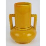 A circa 1890 Ault- like earthenware deep yellow glazed vase with bulbous base,