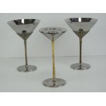 Stuart Devlin: a pair of cocktail / Martini glasses (vessels) having the classic gold plated relief