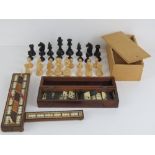 A folding wooden cribbage board inlaid with rosewood and boxwood with bone peg holders,