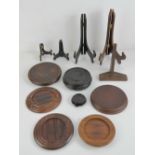 A quantity of assorted turned wooden stands, plate racks etc.