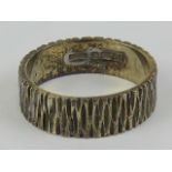 A 9ct gold ring having bark effect and hallmarked London, size M, 3.9g.