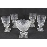 Absinthe: a set of four Pontarlier glasses, circa 1900, with lemon squeezer squared foot,