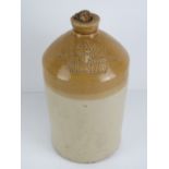 A two tone salt glazed stoneware advertising flagon; 'WS Neal Wine & Spirit Merchant, BELL HOTEL,