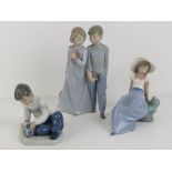 Three assorted Nao figurines, 12-23cm.