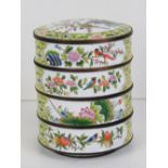 A Chinese Canton enamel on brass dressing table stacking pots opening to reveal three compartments,