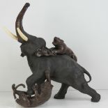 A fine quality late 19th century Meiji era (1868-1912) Japanese bronze elephant and tiger group by