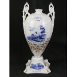 A Shelley golf themed baluster vase bearing the legend 'A miss is as good as a mile' and under