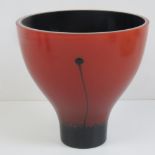 A Caithness glass open vase, red exterior, black interior, 14cm diameter.