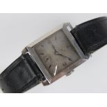 Tank cased steel wrist watch: a c1950 steel cased gents STAYTE mechanical wristwatch with leather