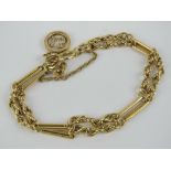 An 18ct gold bracelet having alternating twin rows of rope chain and bar links,