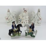 An opposing pair of Staffordshire flat back figurines each being a rider, musket in hand,