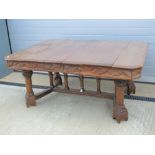 Arts and Crafts Extending Oak dining Table: an oak table possibly designed by Philip Webb,
