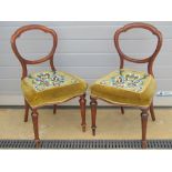 A good pair of mahogany framed hall or bedroom chairs, each raised over reeded tapering legs.