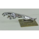 A chrome Jaguar car bonnet mascot in the form of a leaping jaguar, 7 1/2" (19 cm) in length.