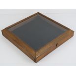 A mahogany framed table top glazed display box, 30 x 30cm.