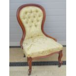A good mahogany framed button back over-stuffed drawing room chair,