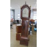 An eight day striking long case clock having painted arch top dial, Roman numerals,