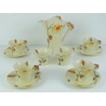 A Clarice Cliff Bizarre 'Yellow Rose' pattern coffee service,