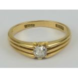An 18ct gold and diamond solitaire ring, the round cut brilliant diamond approx 0.