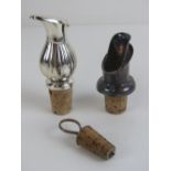 A small carafe cork and silver plated and stopper together with two wine pouring spouts.