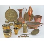 A quantity of assorted brass and copper wares including balance scales, jug, mortar and pestle, etc.