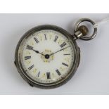 A hallmarked silver fob watch having white enamel dial with gilt decoration,